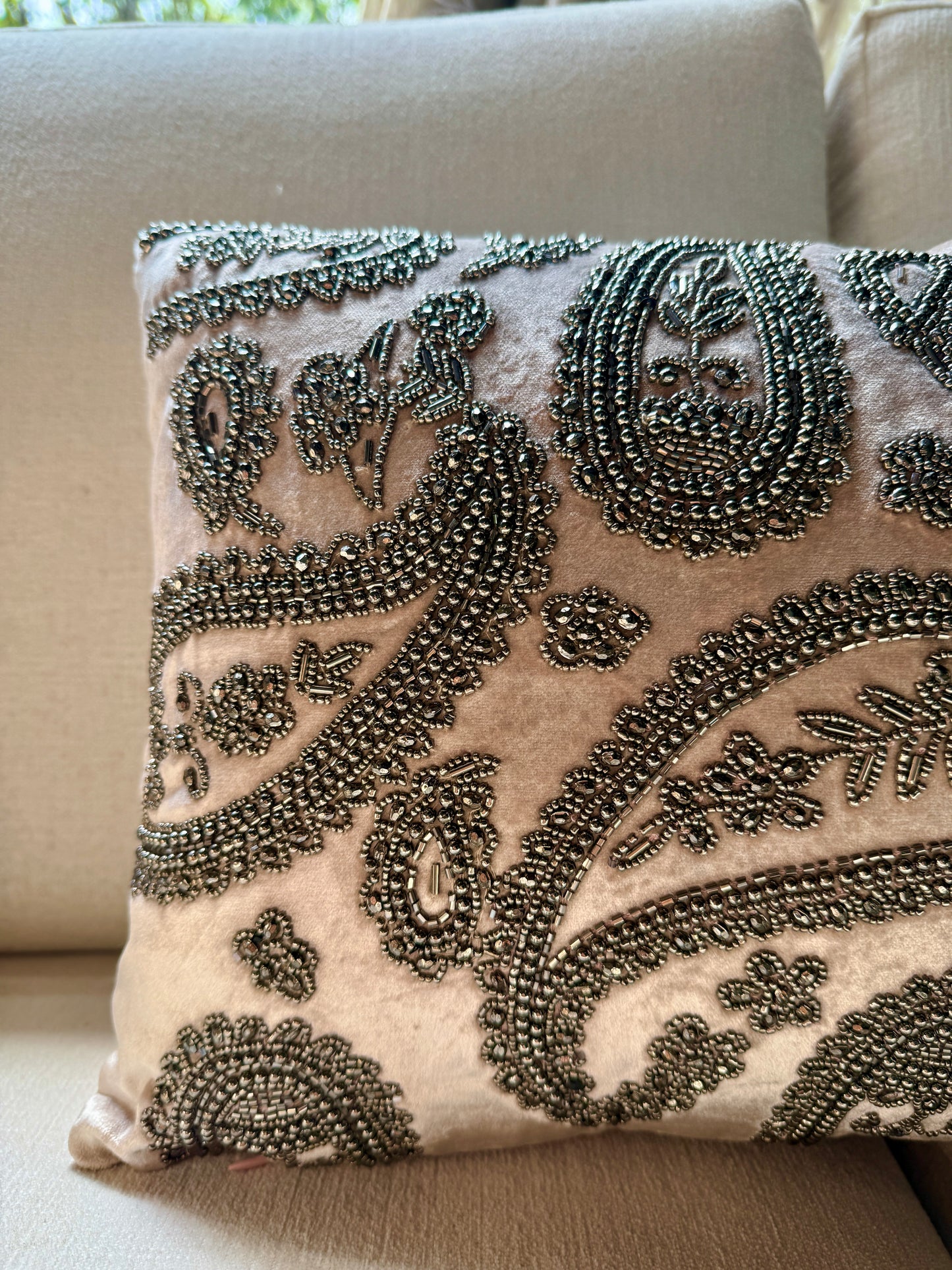 Intricately hand-embroidered with antique-finish beads in classic paisley motifs, this piece is a celebration of Indian craftsmanship and quiet luxury. 