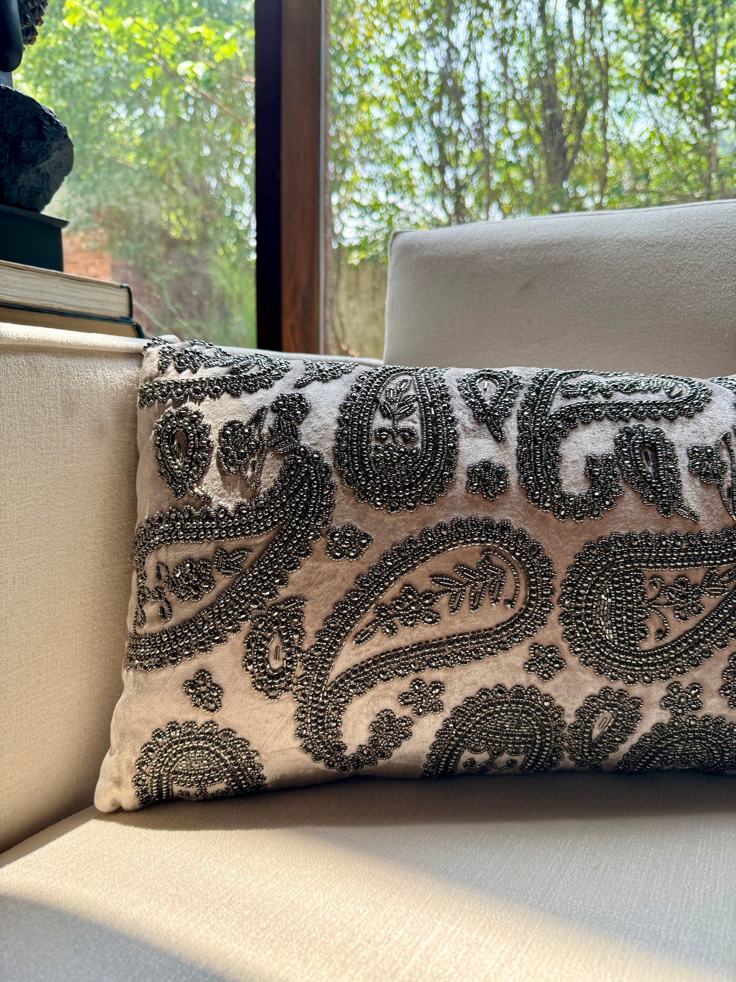Intricately hand-embroidered with antique-finish beads in classic paisley motifs, this piece is a celebration of Indian craftsmanship and quiet luxury. 