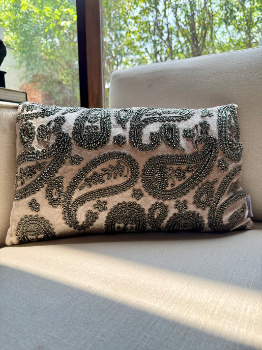 Intricately hand-embroidered with antique-finish beads in classic paisley motifs, this piece is a celebration of Indian craftsmanship and quiet luxury. 