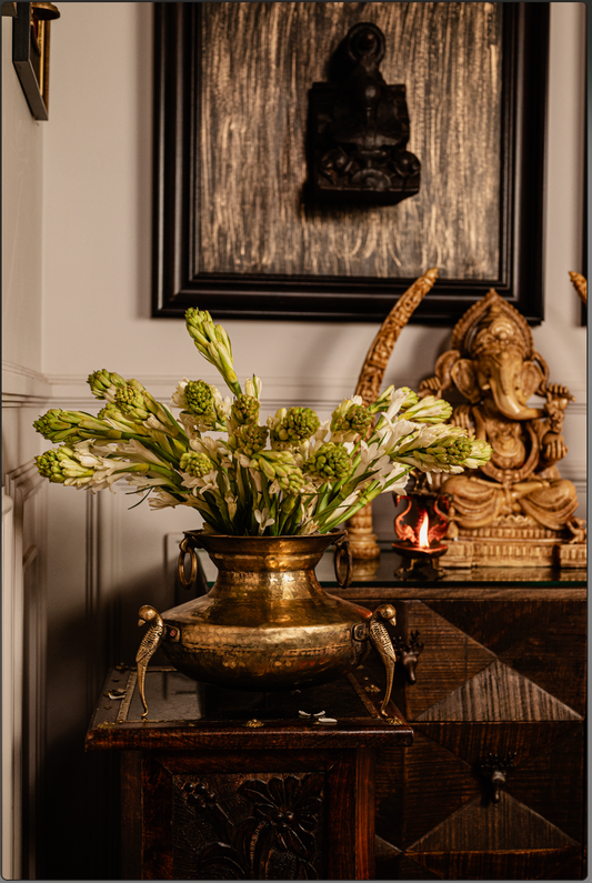 Antique Brass Matka Vase  Enhance your home with the timeless beauty of our Antique Brass Matka Vase, featuring exquisite bird detailing on the handles. Handcrafted by skilled artisans, this vase blends tradition with elegance, making it perfect for displaying fresh blooms, dried arrangements, or as a striking standalone piece. 