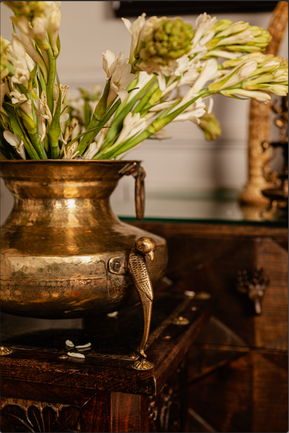 Antique Brass Matka Vase  Enhance your home with the timeless beauty of our Antique Brass Matka Vase, featuring exquisite bird detailing on the handles. Handcrafted by skilled artisans, this vase blends tradition with elegance, making it perfect for displaying fresh blooms, dried arrangements, or as a striking standalone piece. 