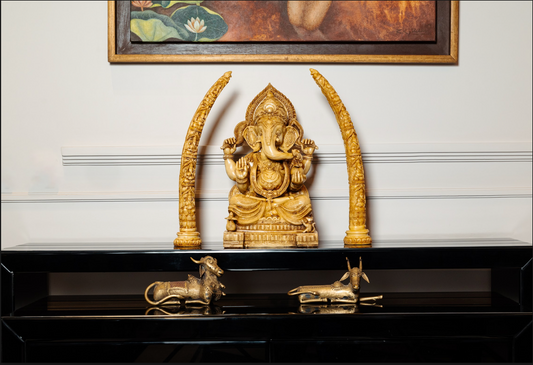 The beautifully detailed Ganesh idol exudes serenity and grace, symbolizing wisdom, prosperity, and the removal of obstacles. Complementing the idol, the camel bone tusks add a regal touch to your decor. 