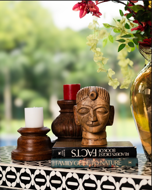 The Shanta Gauri is a hand-carved wooden bust that embodies quiet strength and meditative calm. Inspired by the divine essence of Gauri — the goddess of purity and compassion — this sculpture radiates serenity with its closed eyes and tranquil expression. 