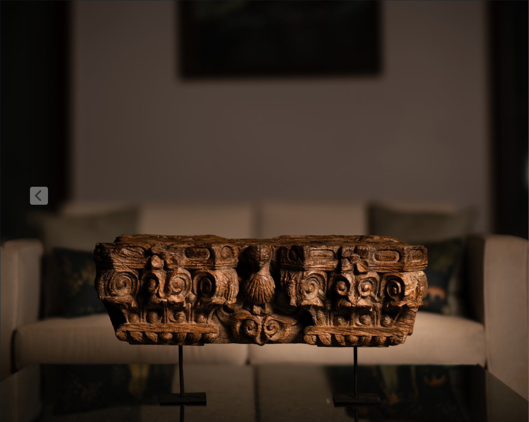 The Garuda Shilp is a remarkable salvaged fragment of heritage architecture, hand-carved from solid wood. With ornate scrollwork and a central bird motif reminiscent of Garuda, it reflects the grandeur and symbolism of temple and haveli design. 