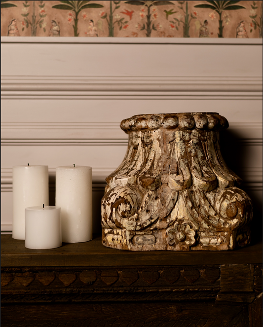Hand-carved from reclaimed solid wood, the Ratna Stambh Candle Pedestal is a fragment of heritage reimagined for modern homes. Its intricate floral motifs, fluted carvings, and weathered patina evoke the richness of temple and haveli architecture