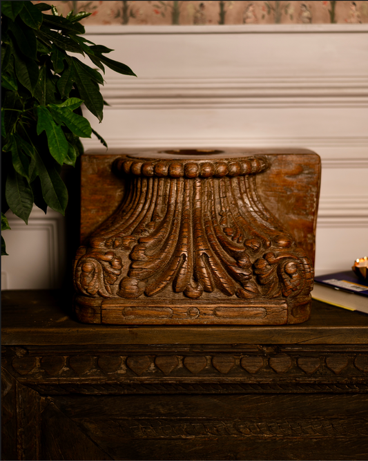 Hand-carved from solid reclaimed wood, the Padma Stambh Candle Pedestal is a statement of timeless grandeur. Its fluted, lotus-inspired detailing and natural aged finish recall fragments of temple architecture, carrying with them a sense of stillness and strength. 