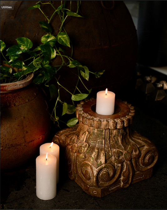 The Harita Stambh Candle Pedestal echoes the grandeur of old-world architecture, carved by hand from solid wood and finished with natural, plant-based green hues.
