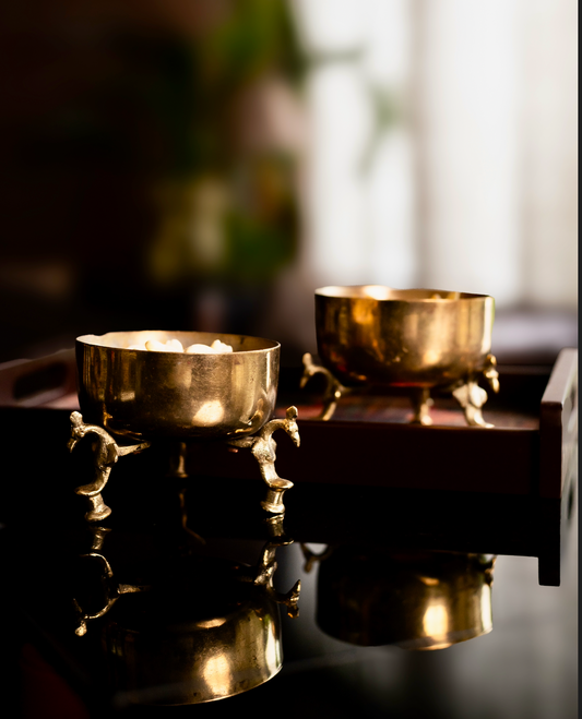 The Hamsa Pātra Brass Bowls are a testament to playful elegance and timeless craft. Handcrafted in pure brass, each bowl rests delicately on sculpted bird-leg bases — making them as artistic as they are functional.