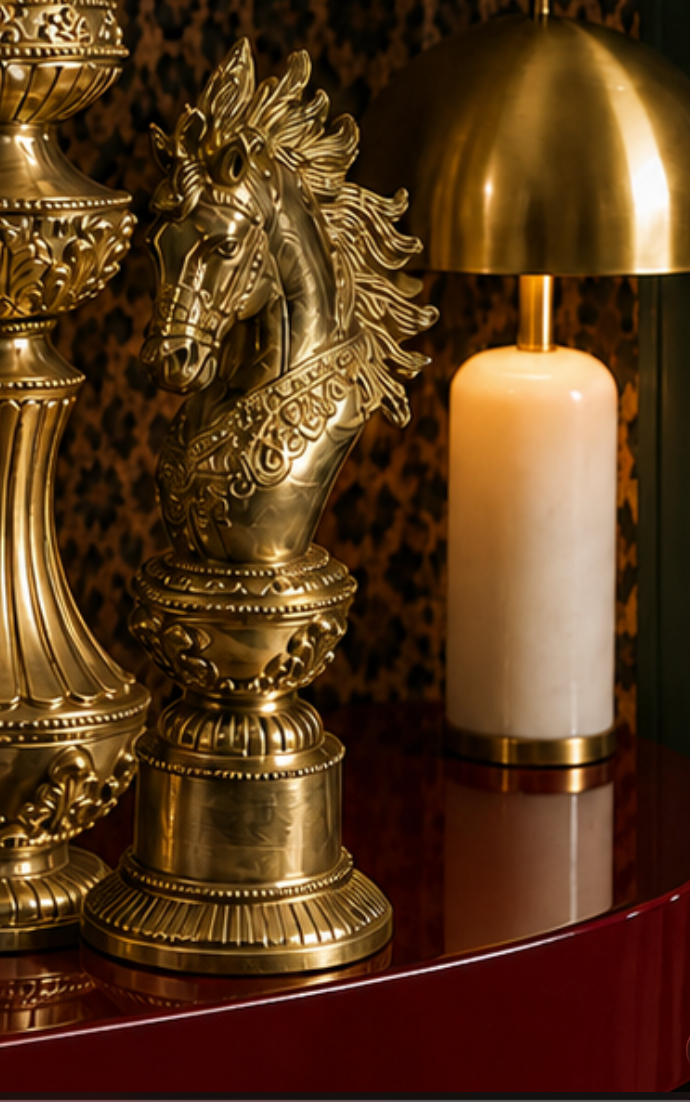 A sculptural set of oversized chess figures, cast in pure brass and finished by hand — the crowned King, the poised Bishop, and the spirited Knight, each rendered with intricate detail from the fluted columns to the ornate crown and flowing mane. 