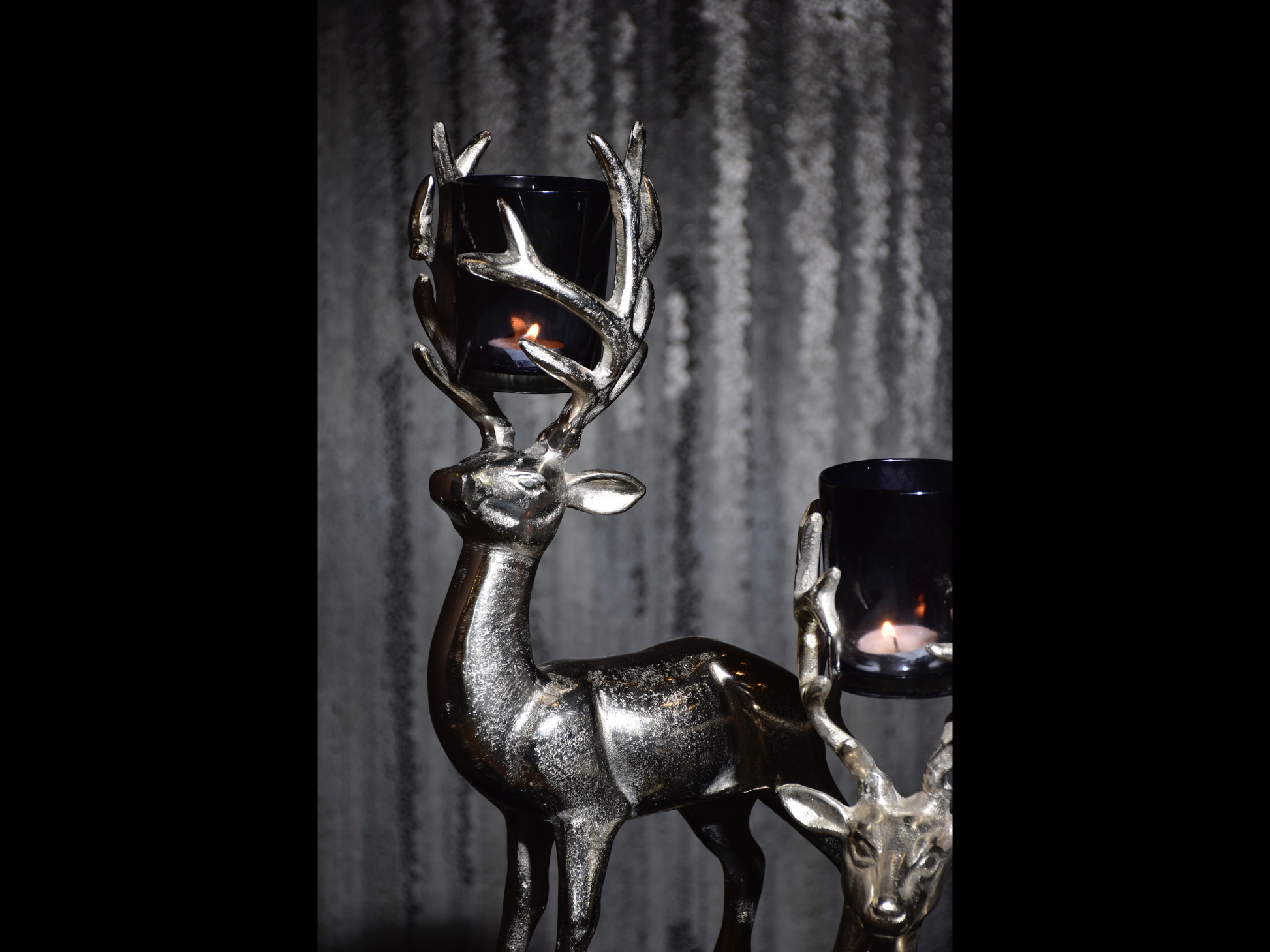 a pair of metal deer candle stand for the purpose of home decor as table decor or shelf decor