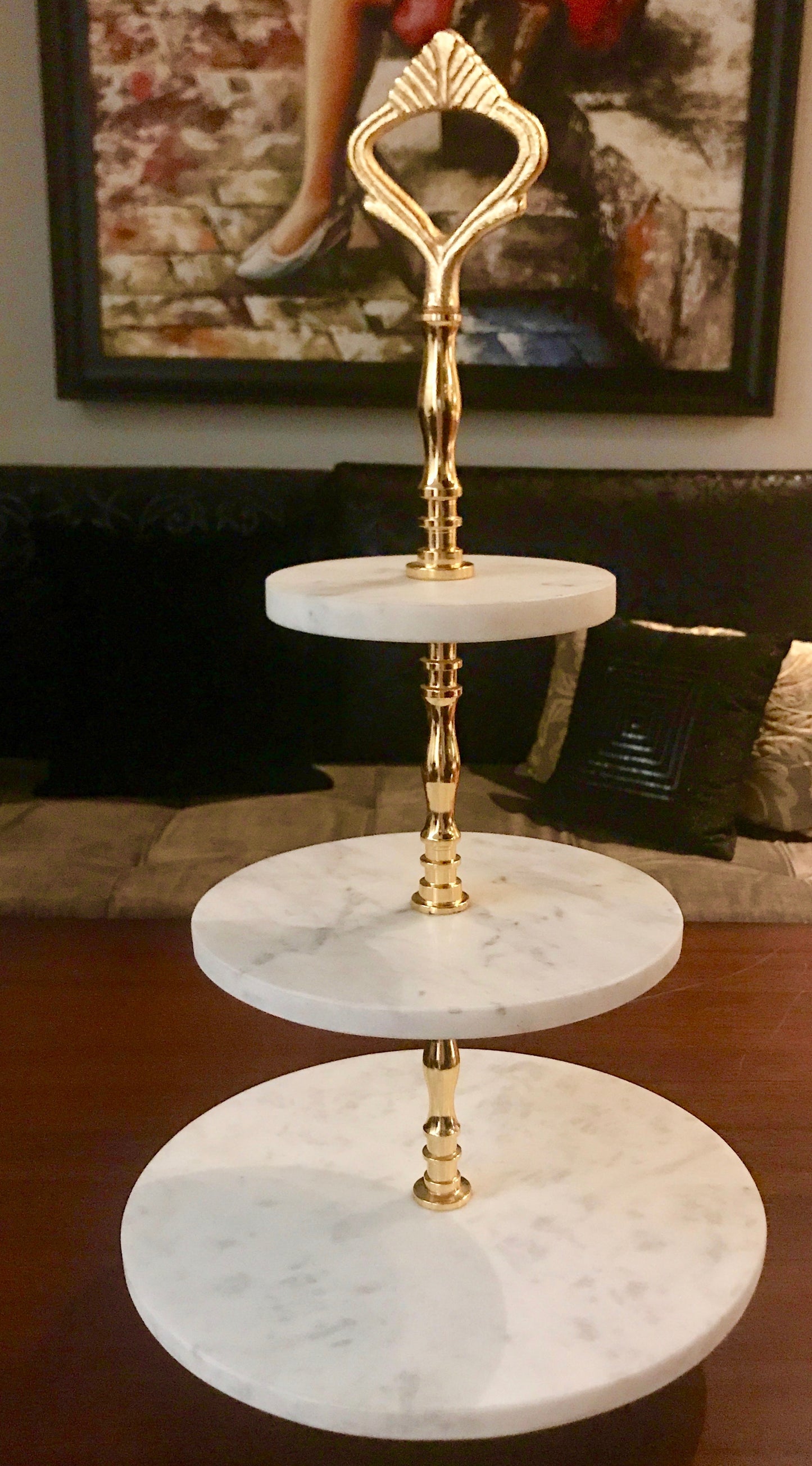 A Marble cake stand with a brass stem with 24ct polish to support the structure.