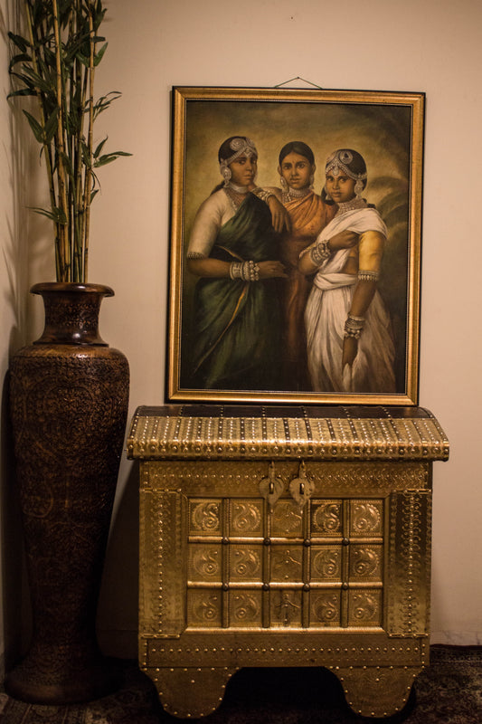 A Brass & Wooden Treasure Chest is Hand crafted out of Sheesham wood with brass sheet cladding, gives it that antique yet imperial look.