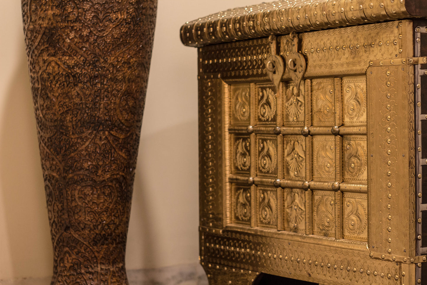 A Brass & Wooden Treasure Chest is Hand crafted out of Sheesham wood with brass sheet cladding, gives it that antique yet imperial look.