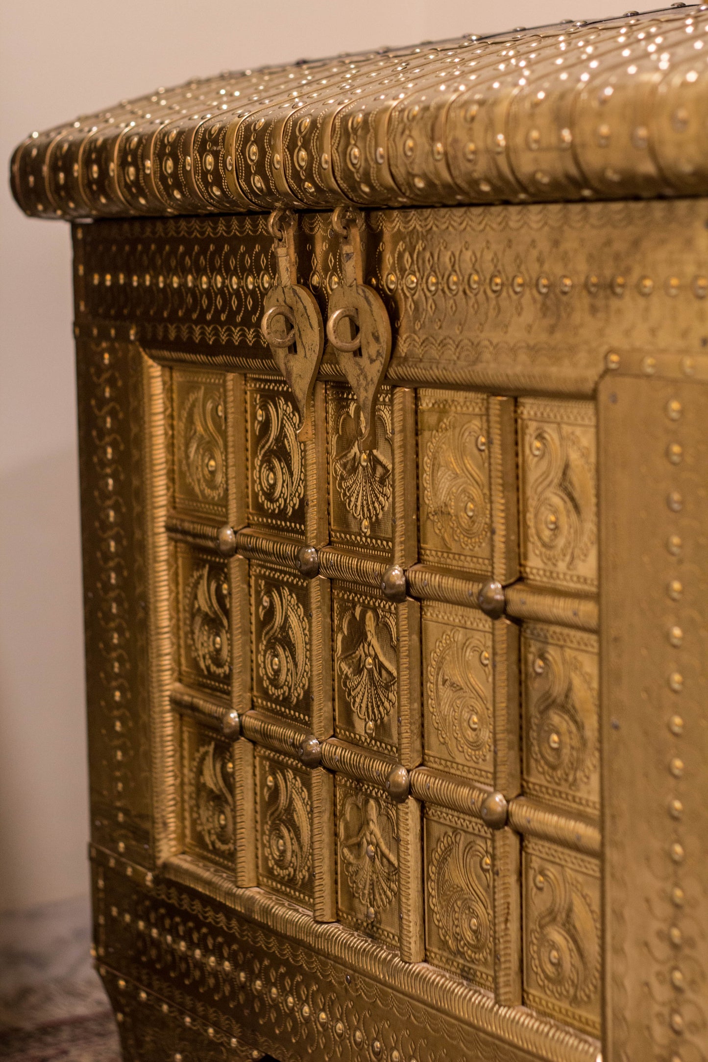 A Brass & Wooden Treasure Chest is Hand crafted out of Sheesham wood with brass sheet cladding, gives it that antique yet imperial look.