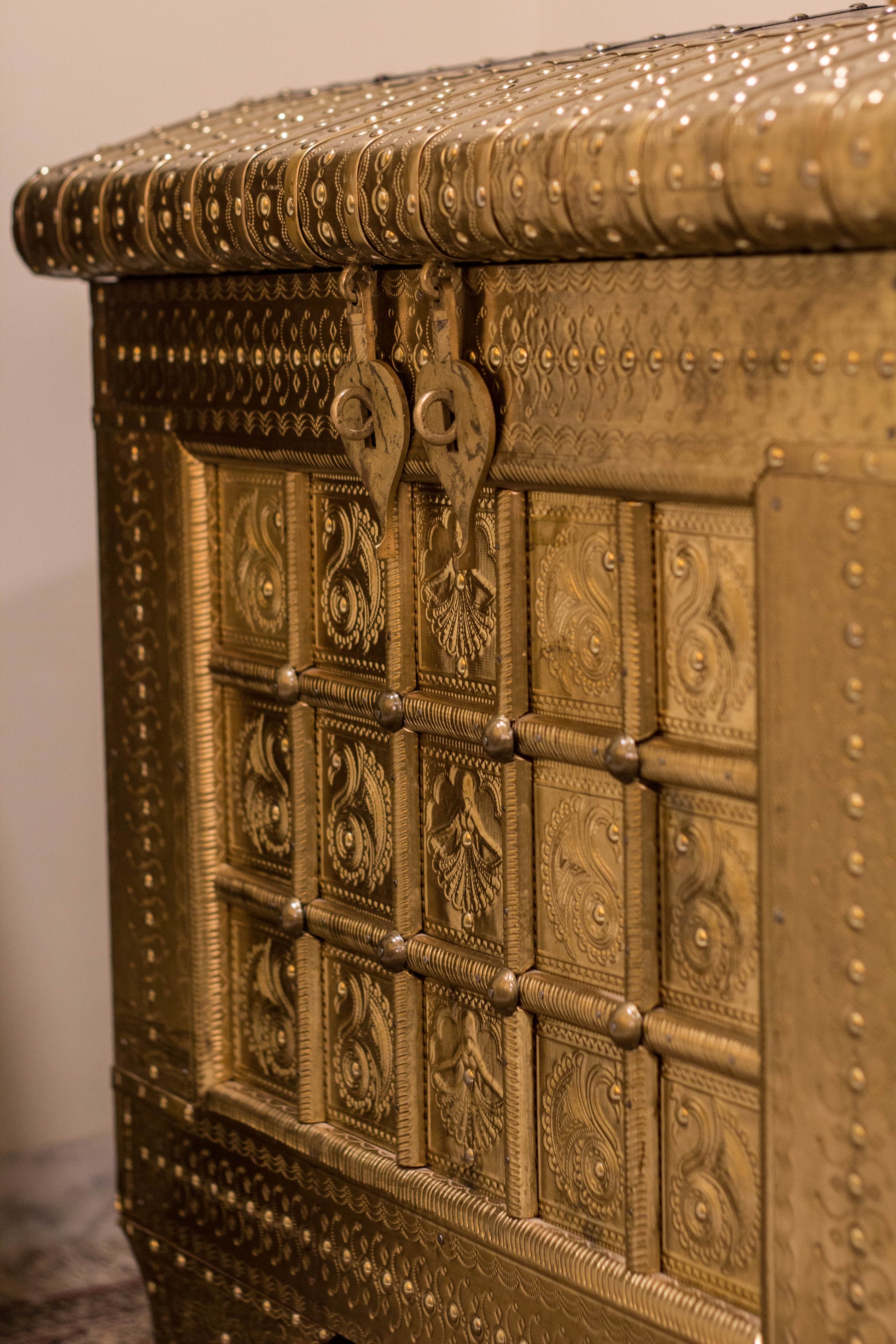A Brass & Wooden Treasure Chest is Hand crafted out of Sheesham wood with brass sheet cladding, gives it that antique yet imperial look.