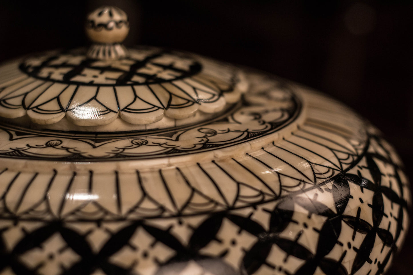 A black & white Camel bone decorative accessory pot.