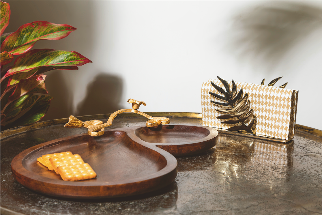 A Kebab Platter made with pure mango wood with two sections for different foods, along with a gold leaf handle detail.