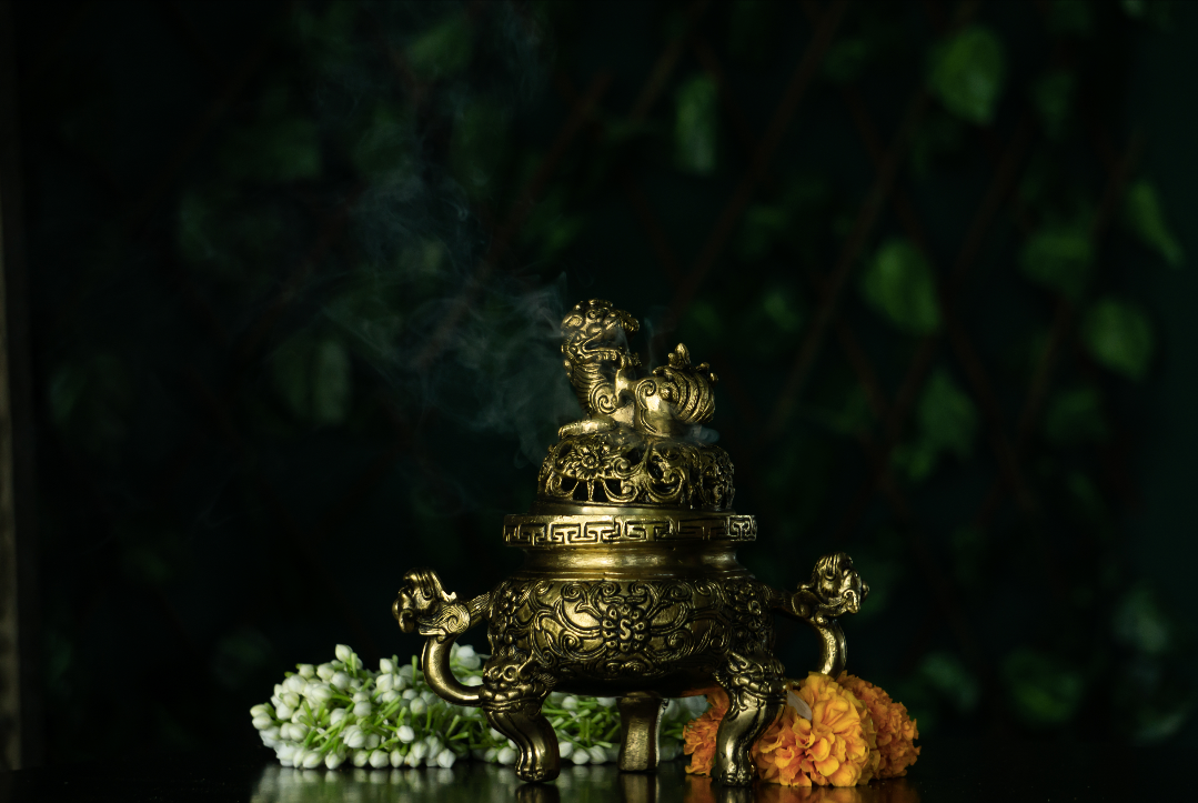 A brass incense burner with an antique gold finish to decorate your home this diwali