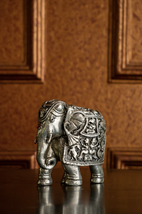 A Stunning Silver Elephant Decorative, hand carved with intricate details.