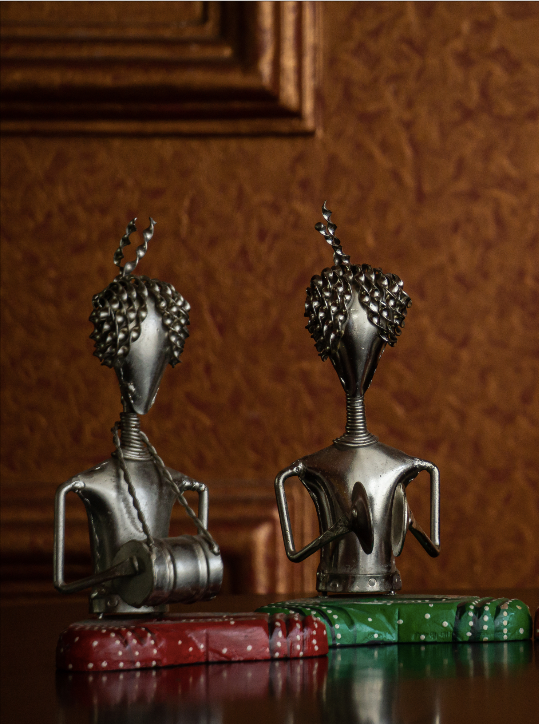 A set of Silver men sitting in a mehfil setting making for a unique home decor decorative piece set.