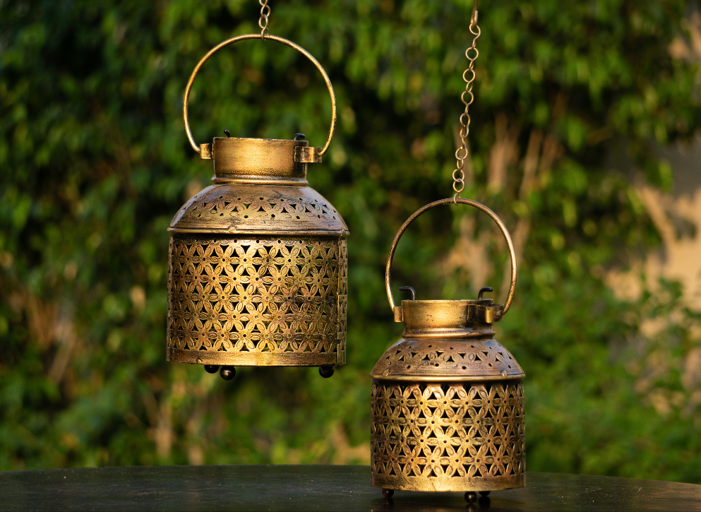 an antique gold jaali candle stand with provisions to hold tea light candles