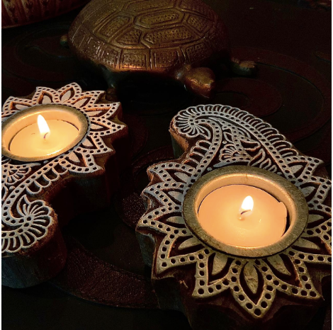  Imprint block Tea Light holders are Made of 100% sheesham Wood & are Available as a set of 2. these come in floral & elephant patterns.