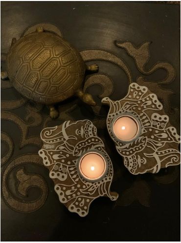  Imprint block Tea Light holders are Made of 100% sheesham Wood & are Available as a set of 2. these come in floral & elephant patterns.