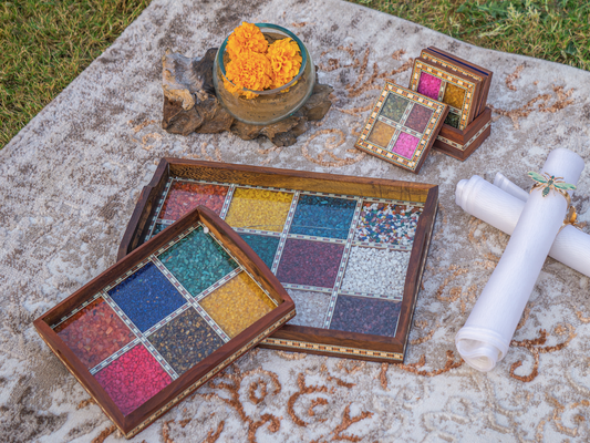 A Wooden Tray with a inlay of various gemstones to give it a colourful and unique appeal, with a glass & wooden frame covering the gemstones.