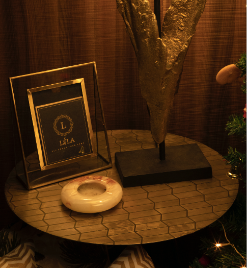 A Brass Table is topped with a geometric pattern.