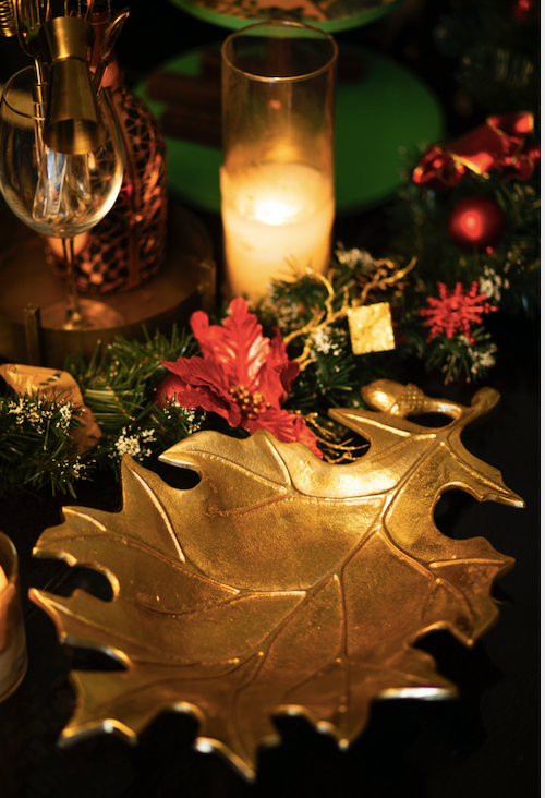 A beautifully handcrafted platter Made with Brass in shape of a maple leaf, in a gold finish.