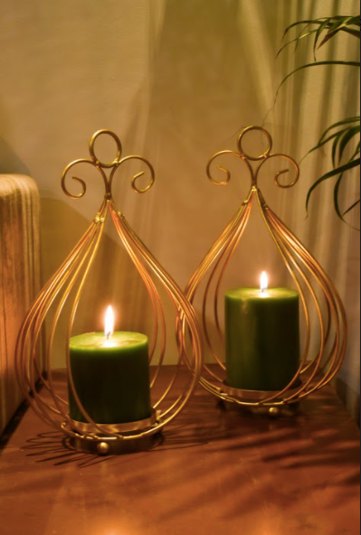 Netter Candle Stands are Made of Metal with Gold Finish and a Glass Candle Container Within.
