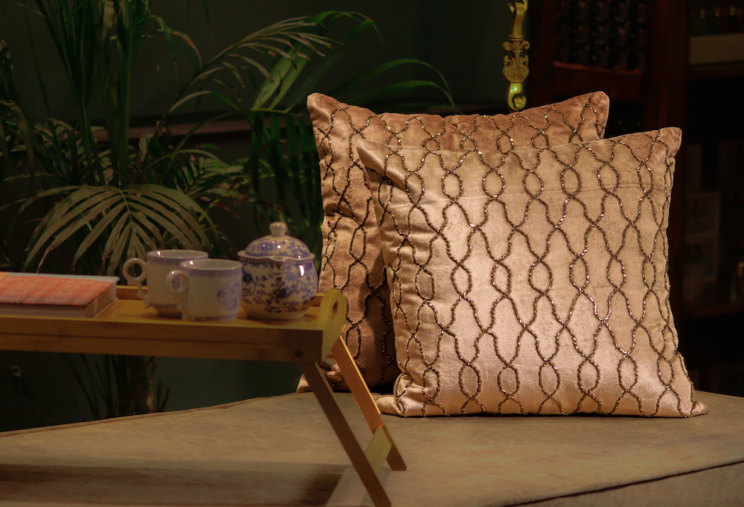 This Pale Brown Beaded Beauty is hand-beaded on Velvet in A Beautiful Interlocking pattern, giving the cushion an elegant & glamorous appeal.