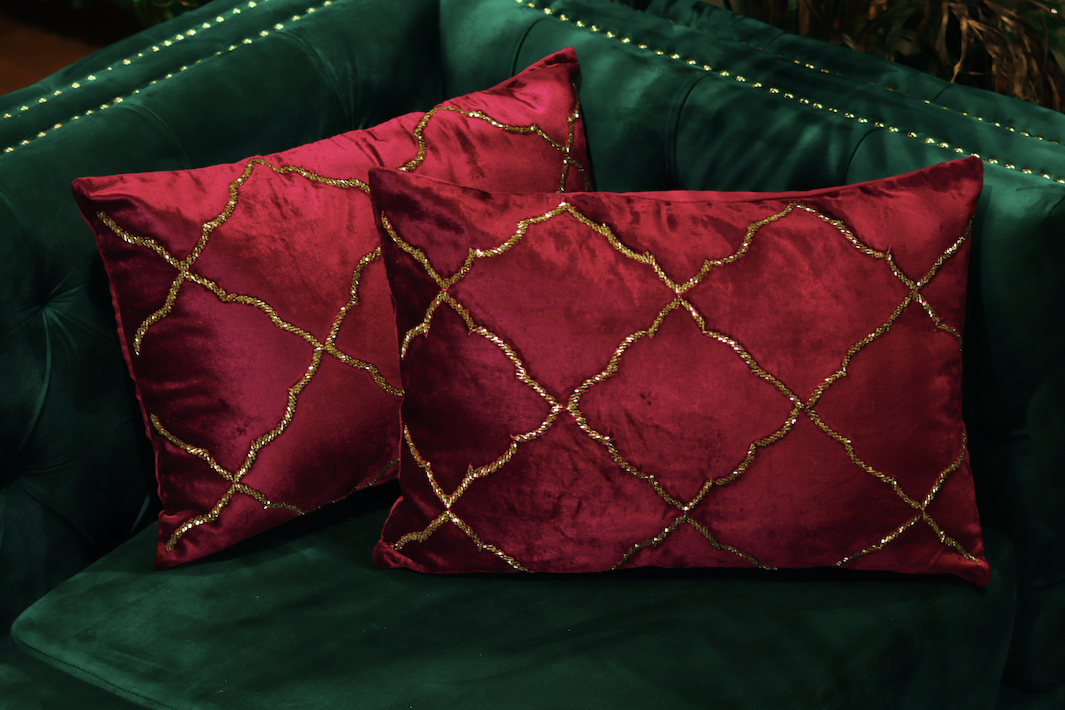 With a Deep Red, The Cushion has hand sewn gold details running throughout the cushion, making it an ethereal beauty. 35 x 50 cms