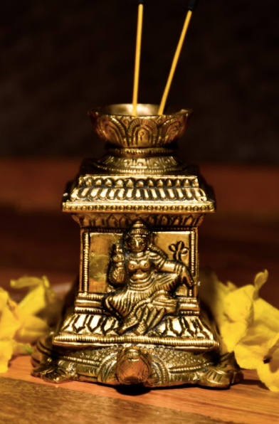An Agarbatti / Incense Stand Made of Brass With Goddess Laxmi Mounted atop a Tortoise.