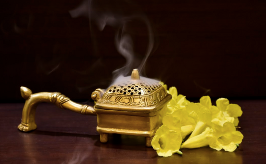 A Square brass dhoop daani used to disperse the dhoop smoke and incense throughout the house or living space.