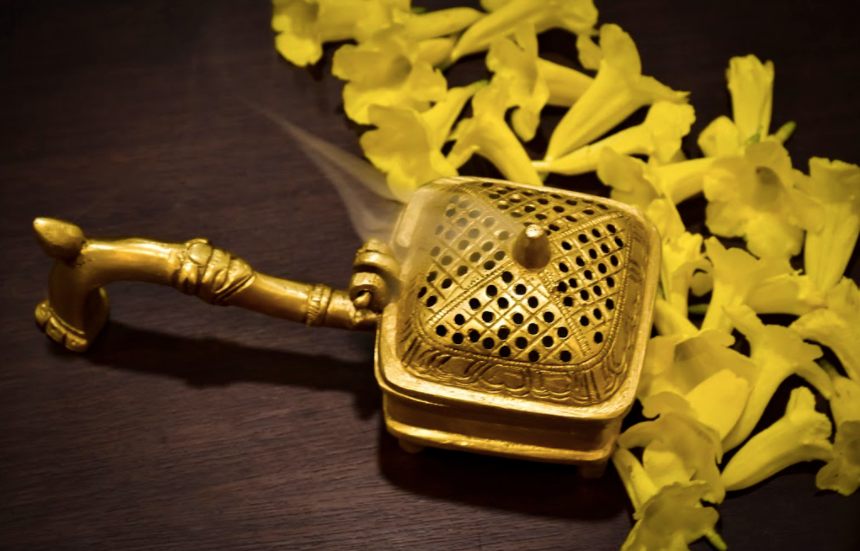 a Square brass dhoop dani used to disperse the dhoop smoke and incense throughout the house or living space.