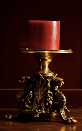 Brass Candle Stands are made of 100% Brass With Jaguar Heads carved onto a brass canvas along with other beautiful details, executed elegantly, supported by three brass legs.