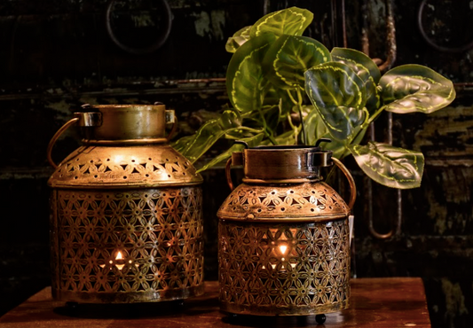 A  Pair Of 2, these brass jaali lanterns are authentic beauties. Inspired by the olden craft culture, the jaali patterns have been hand crafted atop a brass canvas.