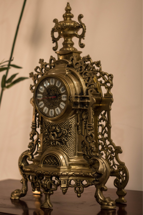  A 100% Brass Clock, carved with intricate beautiful carvings, in an antique finish, supported by Five Legs(5) to give it support. 