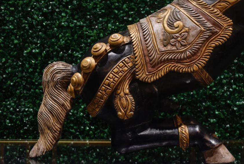 Madhurai Horse Handcrafted using a single piece of wood, this Leela statement artefact was almost destroyed with the ancient temple it was found in! 