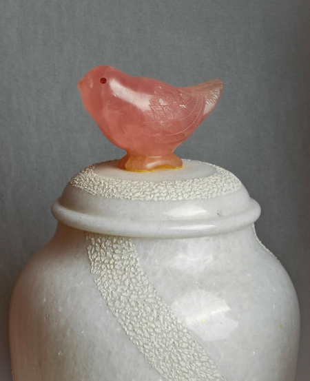 Made with white marble, the textured wave details, wrapped across both the pots along with the semi-precious bird detail on the top lid handle.