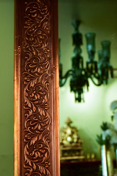  A Glorious Antique Wall Mirror, With the frame made wit Brass in an antique finish with delicate carvings all over the brass frame. 