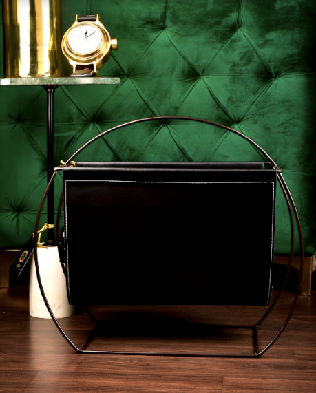 The Leather Magazine holder is Made of Leather, Supported with Iron Legs & Body. 