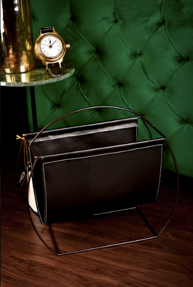 The Leather Magazine holder is Made of Leather, Supported with Iron Legs & Body. 