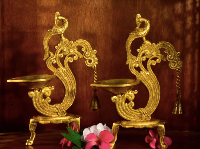 Brass Diyas, made of pure brass in an antique finish with a long bell detail.