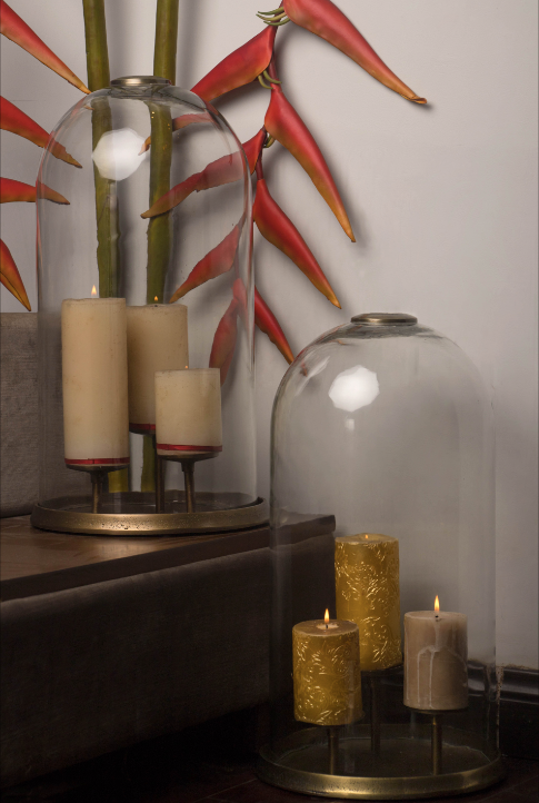 Glass domes dawning the brass stands with 3 candle holders installed within. These come in a pair of two