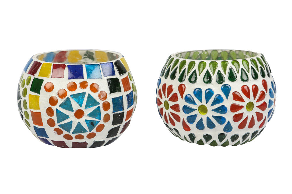 A Colourfull blue pottery tea light holder, with multicoloured glass work on the exterior.